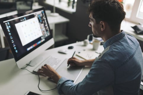 young-graphic-designer-working-office_158595-1137